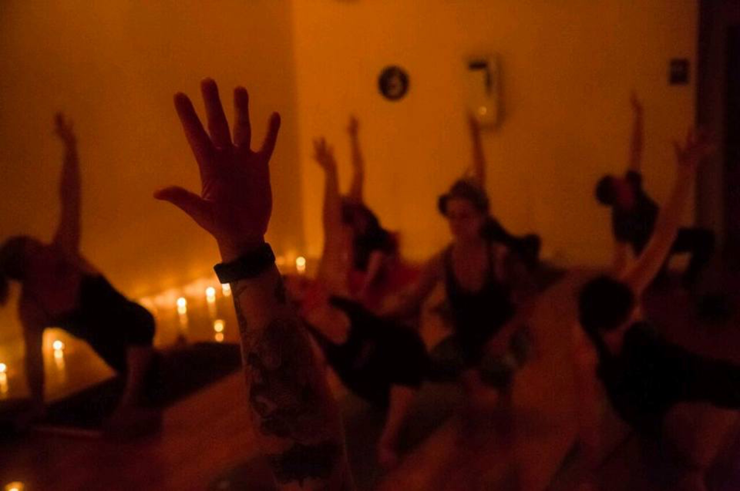 The same candlelit practice, closer — ink, wax light, and breath.